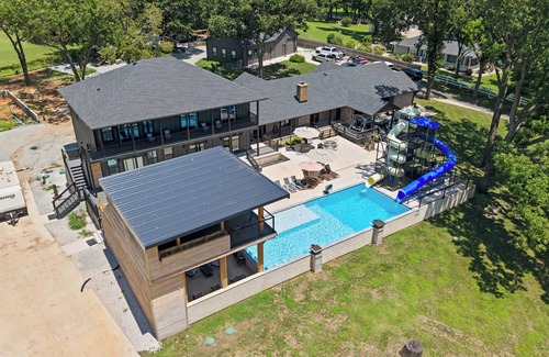 Grove Casa | Giant 10-bedroom lakefront home with large pool, hot tub, and dock