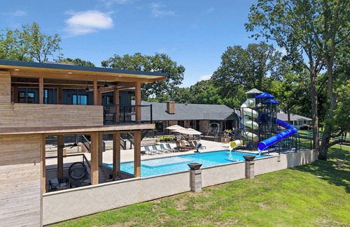 Grove Casa | Giant 10-bedroom lakefront home with large pool, hot tub, and dock