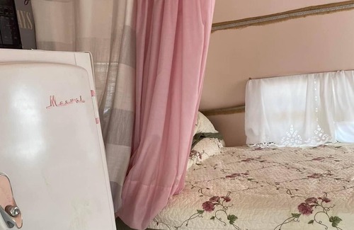 Tucson Cabaña | “Glamping” at its finest. Meet Genevieve, a restored 1959 Fan travel trailer.