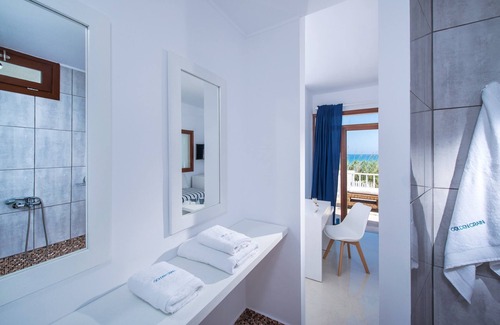 Kokkini Chani Casa | Golden Grain Suites by Checkin