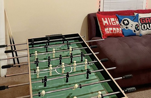 Fayetteville Casa | Golden Hour Cozy 1 Bd with Vibrant Game Room