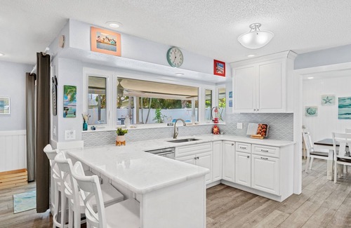 Venetian Way Casa | Gorgeous Beach House W/ Large Outdoor Patio, Heated Pool & Gas Fire Pit!