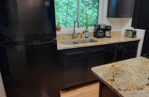 Traverse City Casa | Gorgeous wooded site 15 min from the heart of Traverse City...walk to swimming!