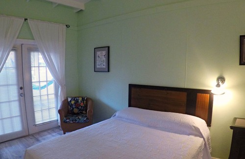 Cockburn Town Casa | Grand Turk Vibes B&B - Balcony room, with 2 queen beds with partial ocean view!