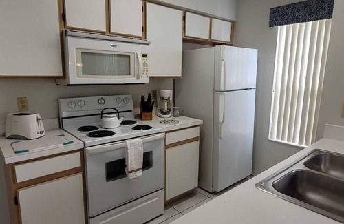 Royal Palm Bay Condominio | Ground floor, With a pond view patio.