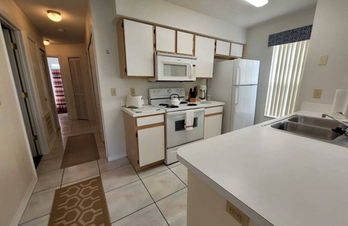 Royal Palm Bay Condominio | Ground floor, With a pond view patio.