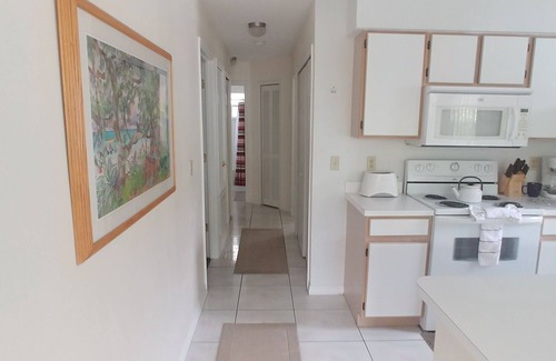 Royal Palm Bay Condominio | Ground floor, With a pond view patio.