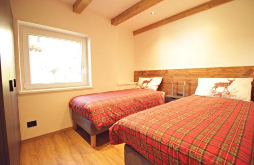 Castello-Molina di Fiemme Apartamento | Guest House Dezulian