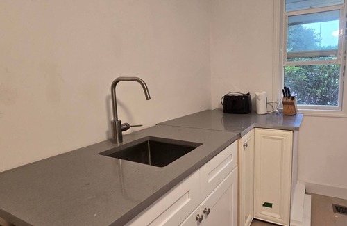 Steveston Casa | Guest Suite Studio One bedroom Large bathroom living room fenced yard Privacy