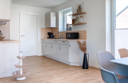 Butjadingen Casa | Haus Meerperle - Experience hygge. Sauna. Fireplace. Dogs welcome.