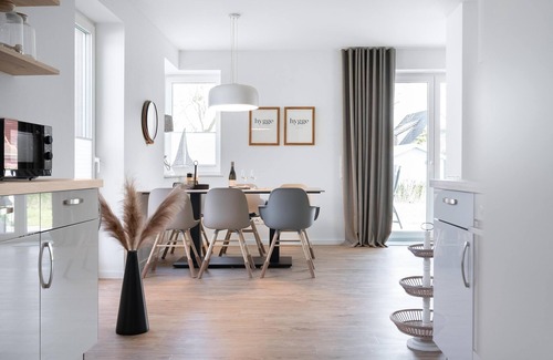 Butjadingen Casa | Haus Meerperle - Experience hygge. Sauna. Fireplace. Dogs welcome.