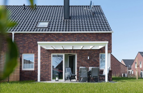 Butjadingen Casa | Haus Meerperle - Experience hygge. Sauna. Fireplace. Dogs welcome.