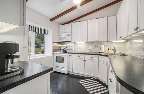 Ludington Cabaña | Hamlin Lake 3 Bedroom, 2 Bath Vintage Cottage with Private Lake Frontage