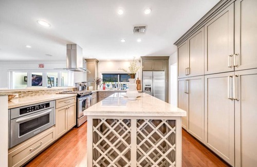 Garden Isles Casa | Heated Pool! WaterFront Home! 1 Mile To Beach!