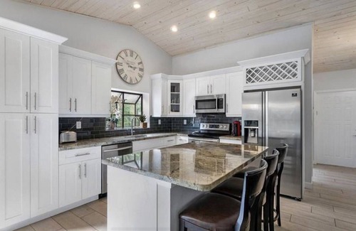 Lake Ida Shores Casa | Heated Saltwater Pool! Beautiful Activity Filled Three BR Home Downtown Delray