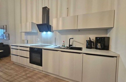 Suderneuland I Apartamento | Herzlich Willkommen in der Exklusiven Ferienwohnung Teefabrik Zentral in Norden
