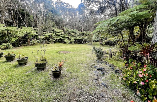 Volcano Casa | Hidden paradise with a hot tub, wood fireplace, large lanai, & jetted tub