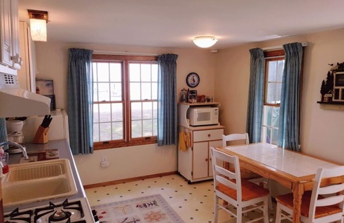 Higgins Lake Casa | Higgins Lakefront Cozy Beach House with Private Boat Mooring Onsite - Brass Bell