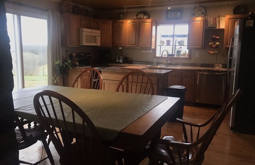 Carlisle Casa | Hilltop Farmhouse with sunrise sunset porch overlooking hills and holler