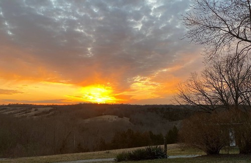 Carlisle Casa | Hilltop Farmhouse with sunrise sunset porch overlooking hills and holler