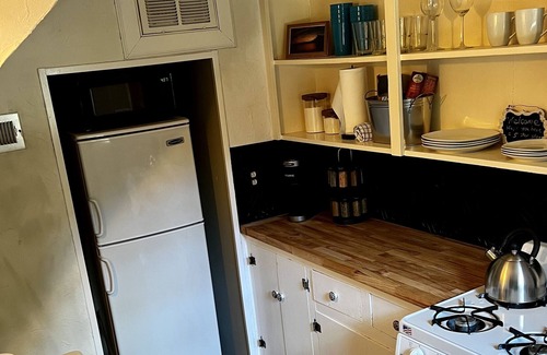 Gastonia Casa | Historic 20s Cottage sits under the breath taking oaks.