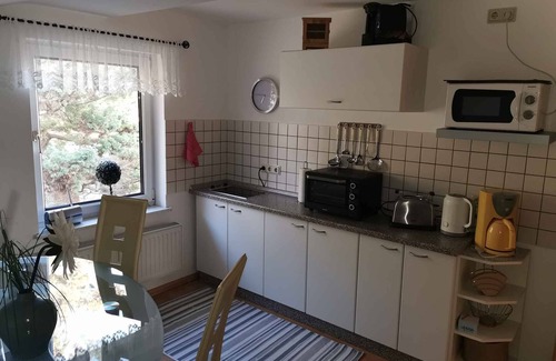 Lietzow Apartamento | Apartamento vacacional con vista sobre el "Jasmunder Bodden" y asientos de jardín