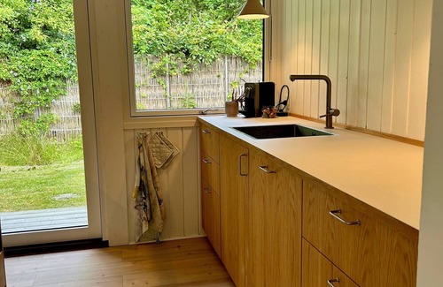 Hojby Cabaña | Holiday home by Denmark's best beach, with large terrace & family activities