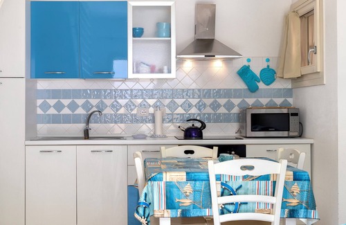 Viddalba Casa | Casa de vacaciones 'Romantica Casa Al Mare' con piscina compartida, Wi-Fi y aire acondicionado