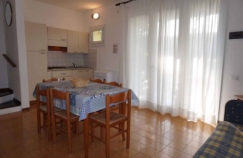 Porto Santa Margherita Casa | Casa vacacional con piscina comunitaria y pista de tenis