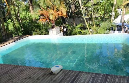 Manapany-les-Bains Casa | Homerez - Casa a 1 km de la playa para 20 pers. con piscina compartida y jacuzzi