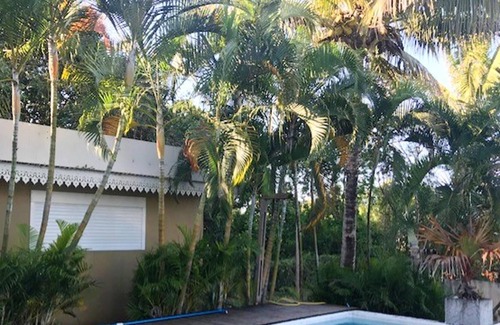 Manapany-les-Bains Casa | Homerez - Casa a 1 km de la playa para 20 pers. con piscina compartida y jacuzzi