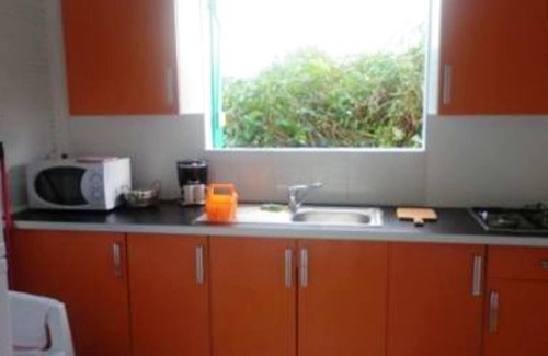 Sainte-Rose Casa | Homerez - Casa para 2 pers. con piscina compartida y jardín en Sainte-Rose