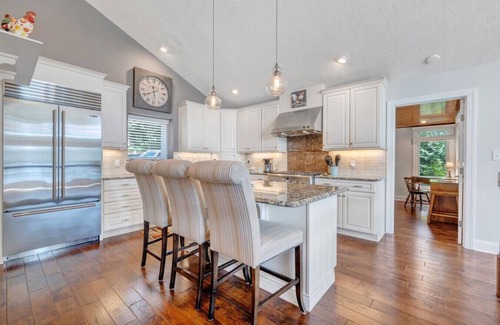Huddleston Casa | Hook & Paddle - Luxury home on SML with kayaks and private dock.