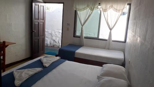 Bahía de la Academia Casa | Hostal Darwin