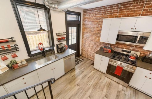 Lawrenceville Casa | HostWise Stays - Prime Location in Lawrenceville, Exposed Brick 2BR Home