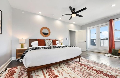 Lower Lawrenceville Casa | HostWise Stays - The Charlotte - Rooftop patio, Garage Parking, Prime Location, Large 3 Story Home