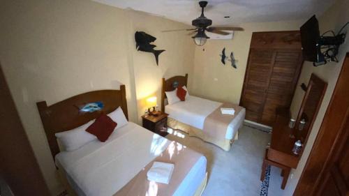 Punta Allen Apartamento | Hotel Fisherman lodge, cuarto base triple