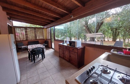 Iglesias Historic Centre Apartamento | House The Ancient Olive Tree, nestled in a centuries-old olive grove with a large garden around it.