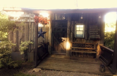 Frontier Cabina | Hunting Cabin Rustic Handcrafted primitive sits in our unique rustic Cowboy Town