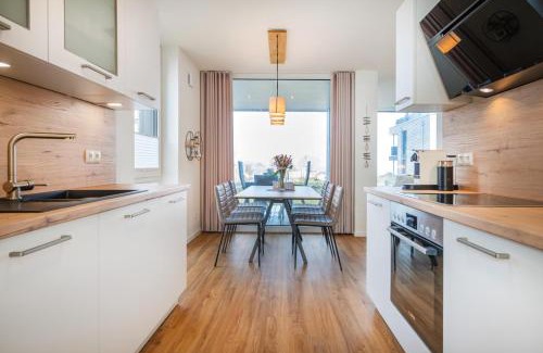 Marienleuchte Apartamento | Hygge – Familienfreundliche Ferienwohnung mit Garten & Meerblick