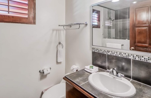 Damas Condominio | Ideal Tropical Retreat W/ Private Patio, Shared Pool, Lush Gardens & More!