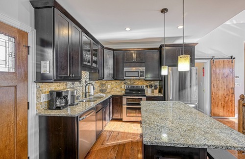 Livingston Casa | Impressive lakefront home with private dock, 2 boat slips, firepit, deck, grill