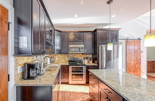 Livingston Casa | Impressive lakefront home with private dock, 2 boat slips, firepit, deck, grill