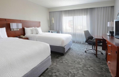North Dallas Hotel | Indulge in Home-Like Comfort! Outdoor Pool, Pet-friendly and Free Parking!