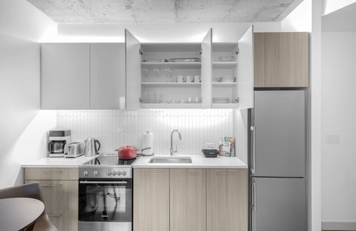 MIT Apartamento | Industrial 1BR near MIT w/ Gym, Doorman, Roof Deck