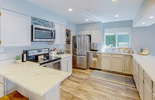 Big Lake Casa | Inviting lakefront home with hot tub, game room, dock, kayaks, pool table, & W/D