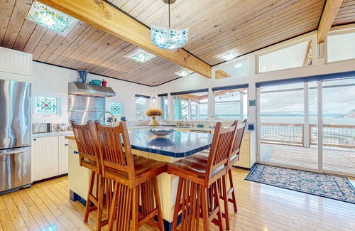 Clinton Casa | Inviting Puget Sound view home with beach access, fire table, hot tub, & W/D