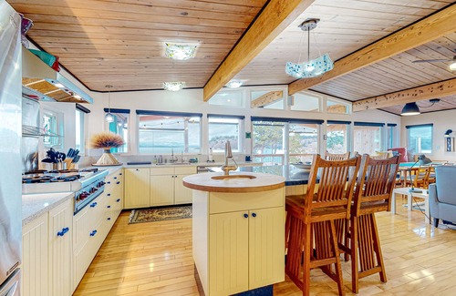 Clinton Casa | Inviting Puget Sound view home with beach access, fire table, hot tub, & W/D
