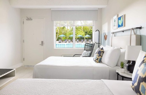 New Town Hotel | Island Charm & Retro Fun | Pools, Comfort Eats, Shuttle & Fire Pits
