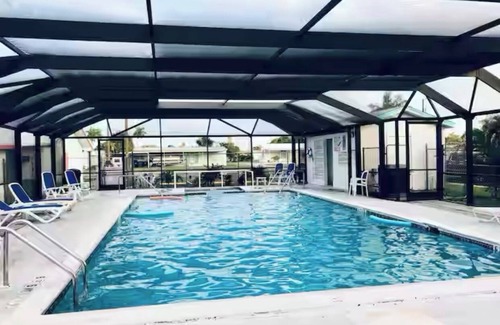 Flamingo Bay Casa | ISLAND TIME! DOCK! POOL! KAYAKS! BOAT To BEACH! PETS ALLOWED!